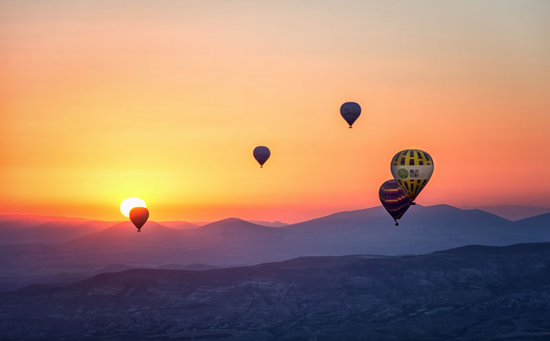 hot air balloons in sunset