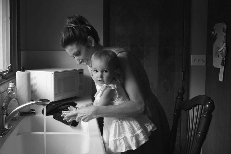 Mom and daughter washing hands